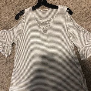 “Cold shoulder” women’s knit top